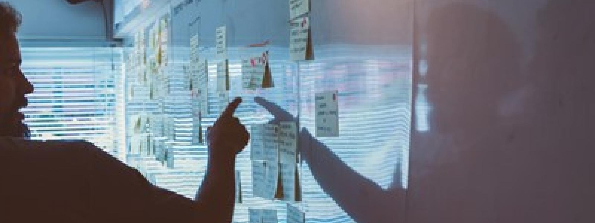 Man pointing at a white board