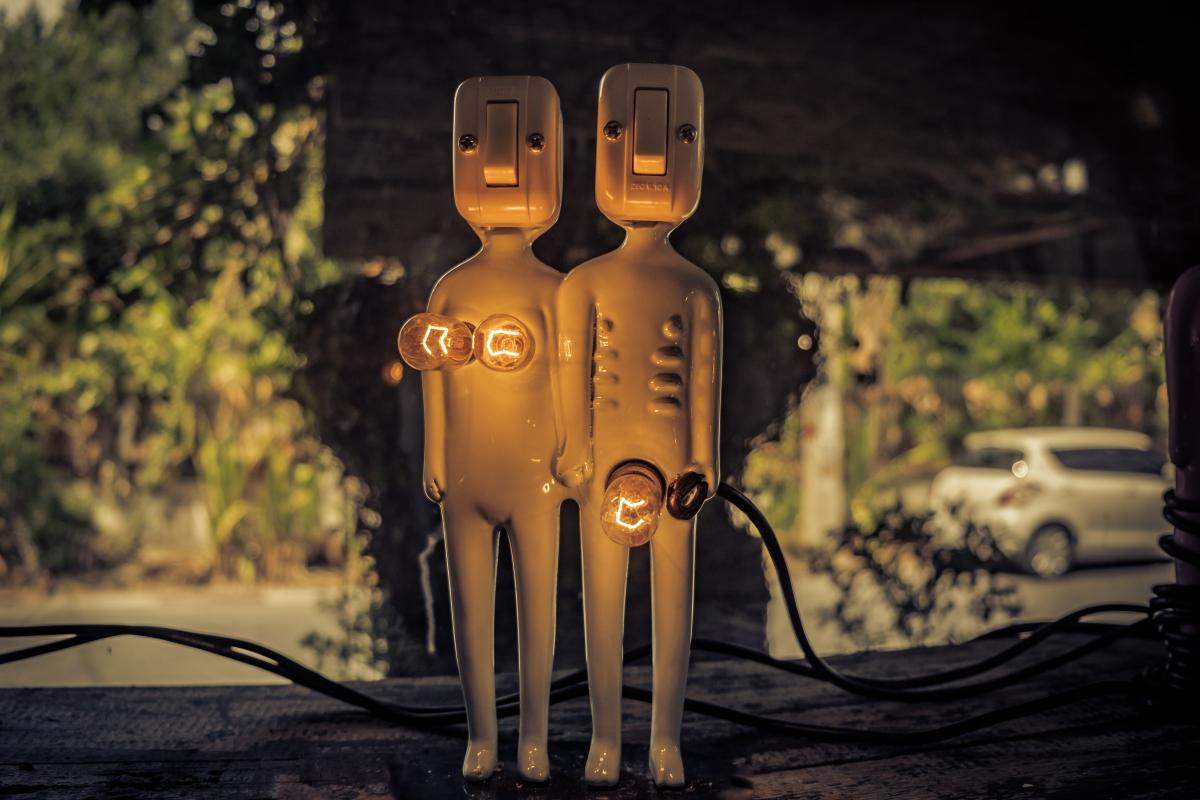Power plugs in the shape of a man and woman's body